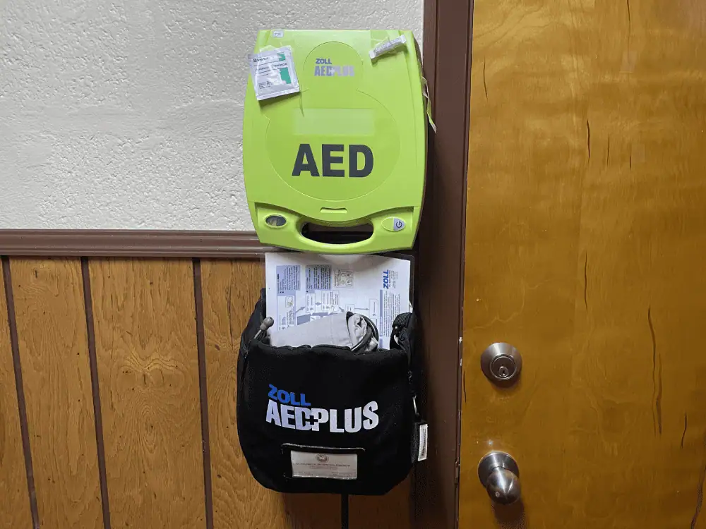 A photo of the church's AED (Automated External Defibrillator) which is located at the bottom of the sanctuary stairs.