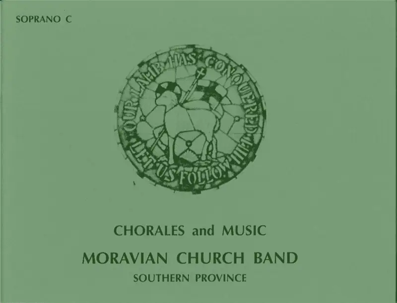 The cover of the green chorale book. In the top right corner are the words "Soprano C". In the middle of the cover is an image of the Moravian Seal as if made from stained glass. Underneath are the words "Chorales and Music. Moravian Church Band. Southern Province."