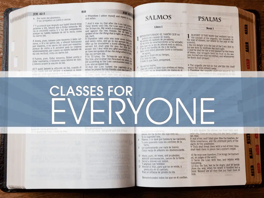 An image of a Bible open to the beginning of the book of Psalms. Across the image is a light blue banner with the words "Classes for Everyone" written in a thin white all-caps sans serif font.