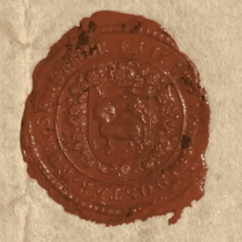 A dark red wax seal on old parchment paper. In the center of the seal the figure of a lamb holding a standard is visible. It is surrounded by decorative arkings. The Latin inscription, Vicit Agnus Noster, Eum Sequamur, is just visible around the edge of the seal.