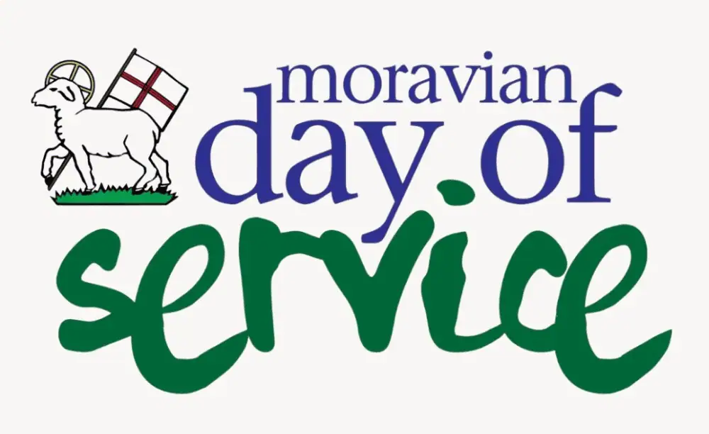 The logo for the annual Moravian Day of Service. The Agnus Dei from the Moravian Seal is in the top left corner. The words "Moravian Day of" are a royal blue color serif font, and the word "Service" is a forest green script font. None of the words are capitalized.