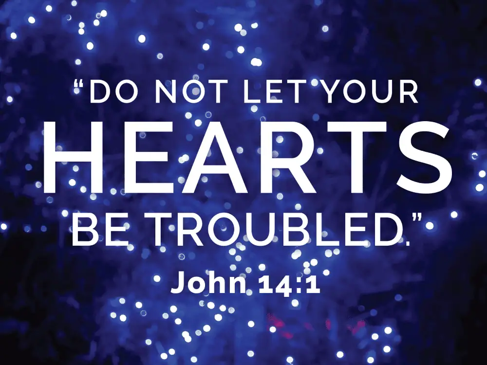 Against a backdrop of blue Christmas lights are the words to John 14:1 "Do not let your hearts be troubled."