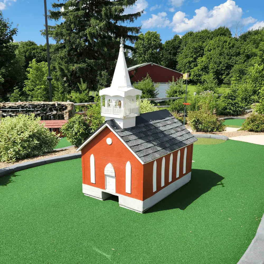 The Mountain View Mini-Golf Course has one hole which features a wooden model of Schoeneck Moravian Church, complete with white crosses on the belfry. The ball enters a hole cut in the bottom of the church and hopefully exits out the other side to drop right into the cup!