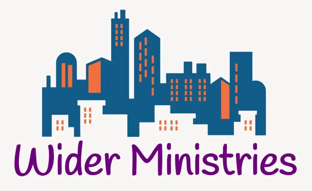 A clip-art imag3e of a city with a group of tall azure blue buildings with orange windows and smaller white buildings with orange windows in front of them. Underneath are the words "Wider Ministries" in purple.
