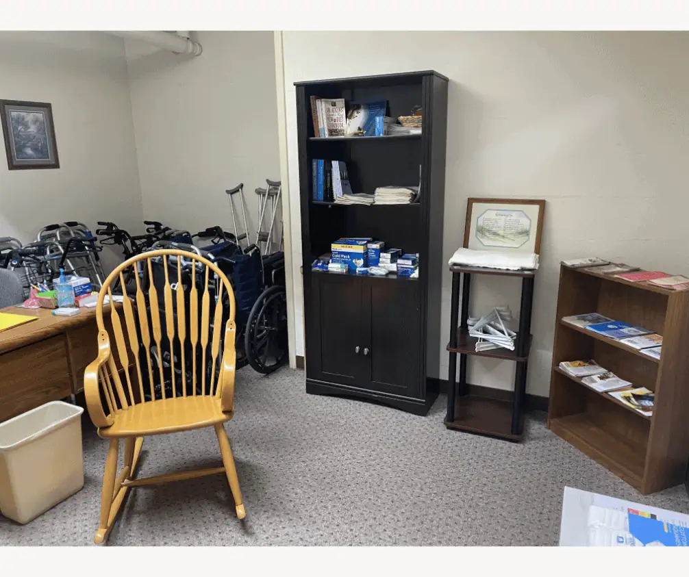 A photo of the Health Ministry Room. There is a display of informative brochures, and a shelving unit with medical supplies on it. A rocking chair sits in front of a desk. Behind the desk are a few wheelchairs, several folded walkers, and a couple pairs of crutches. A photo of the Health Ministry Room. There is a display of informative brochures, and a shelving unit with medical supplies on it. A rocking chair sits in front of a desk. Behind the desk are a few wheelchairs, several folded walkers, and a couple pairs of crutches.