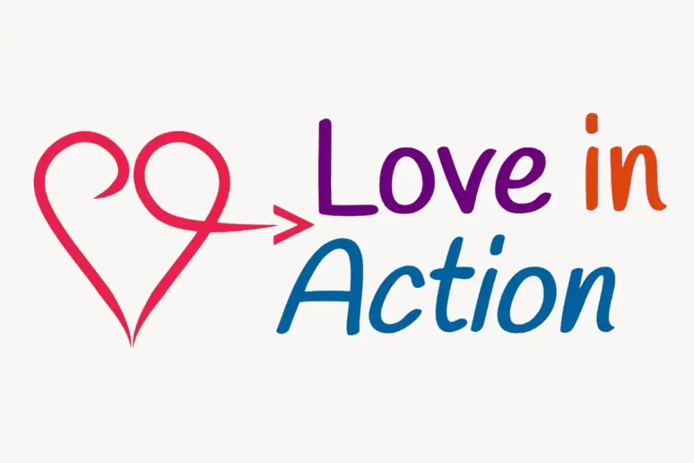 A clip-art image of a red heart with the rounded top right curving under into an arrow, with the words "Love In Action" next to it in an italics sans serif font in purple, orange, and azure blue.
