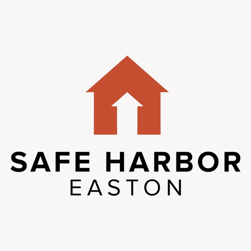 The logo for Safe Harbor Easton, which features a red house with an arrow pointing up for the door.
