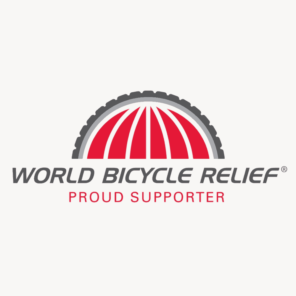 The logo for World Bicycle Relief. Half of a dark grey bicycle tire - with the spokes as red wedges to imitate the lines of a globe. Underneath it says: "World Bicycle Relief: Proud Supporter."